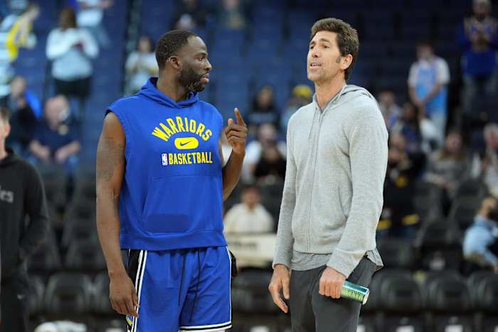 Mar 8, 2022; San Francisco, California, USA; Golden State Warriors forward Draymond Green (23) talks to general manager Bob Myers before the game against the LA Clippers at Chase Center. Mandatory Credit: Darren Yamashita-USA TODAY Sports